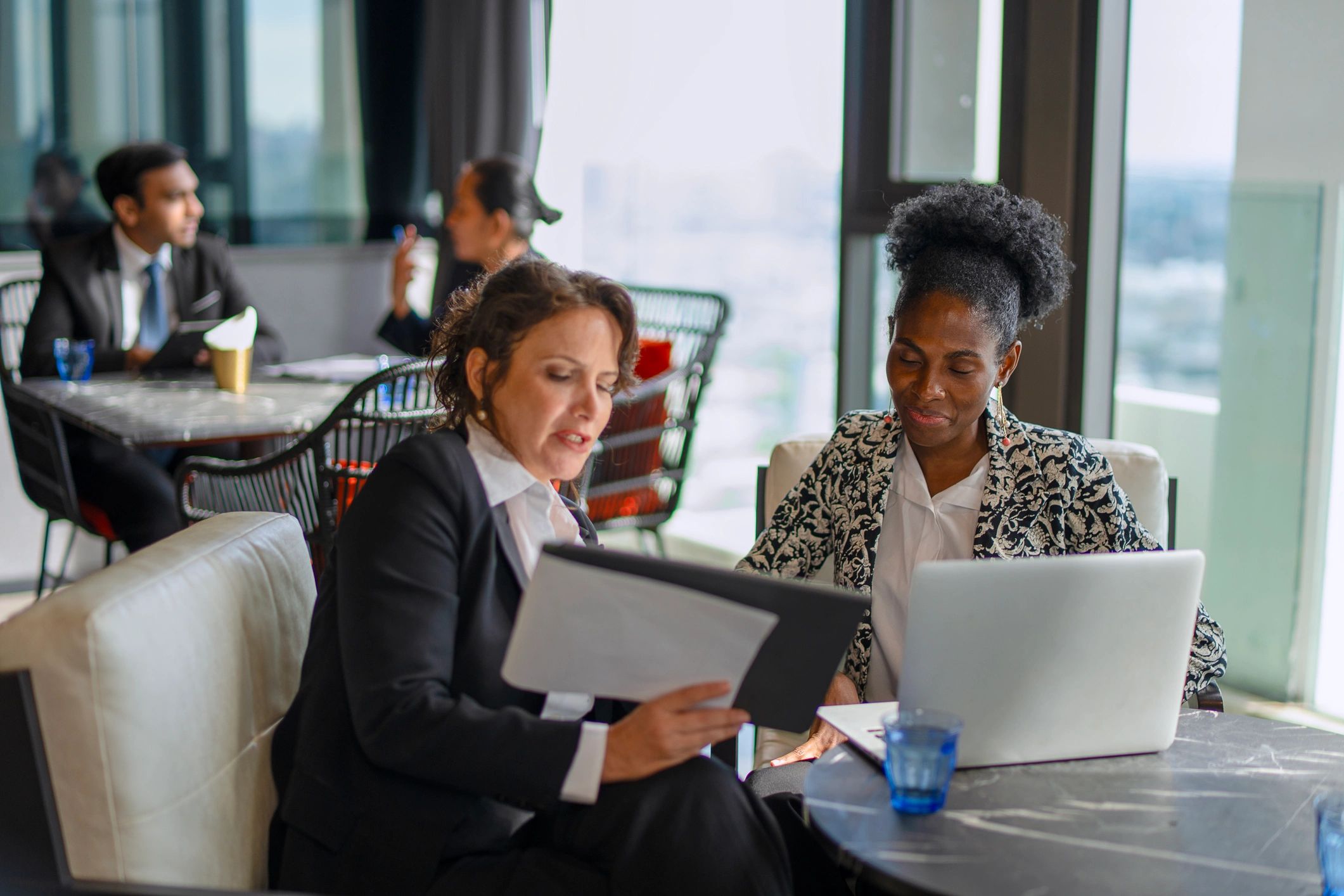 Diverse professional women meeting together in conversation